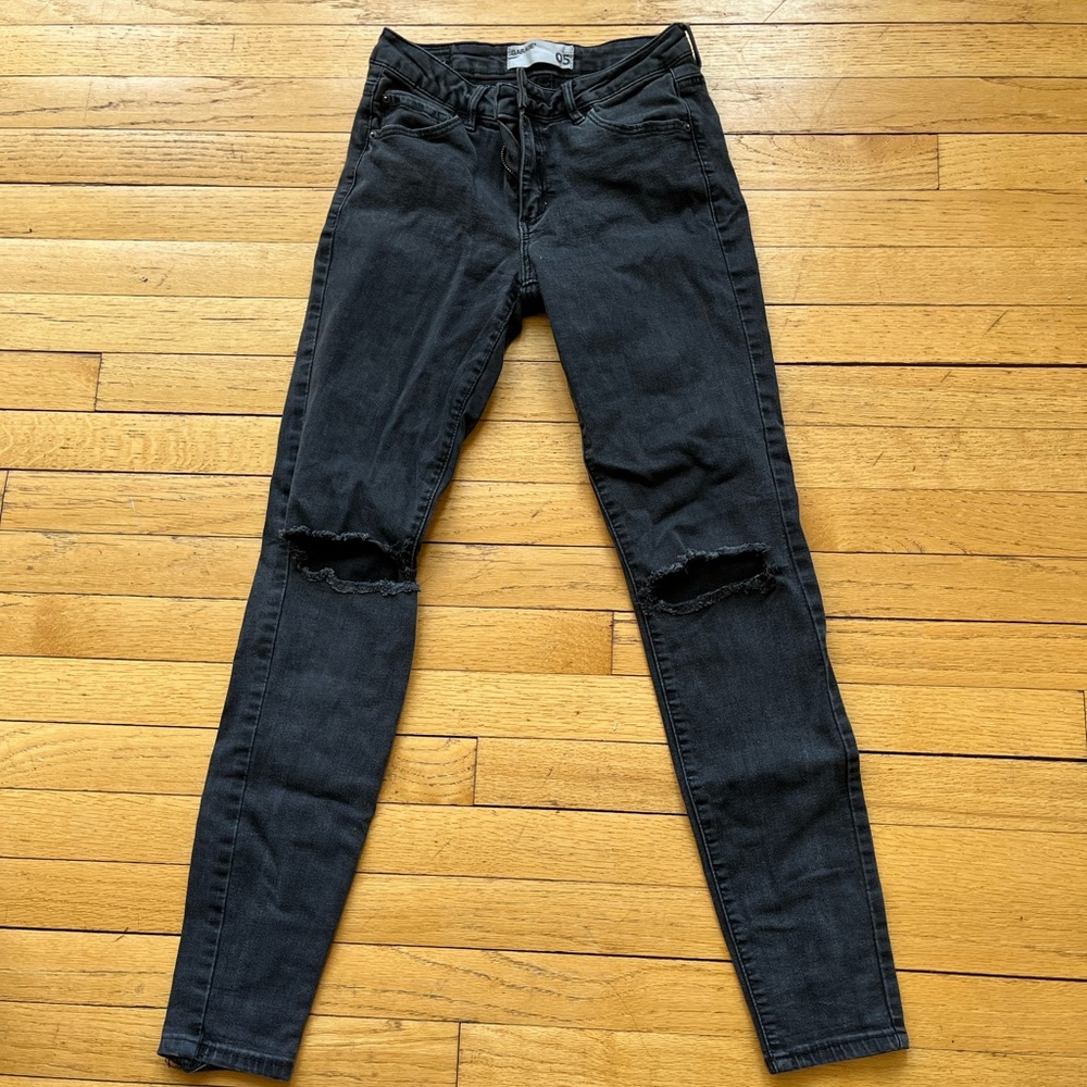Black knee rip skinny jeans from Garage